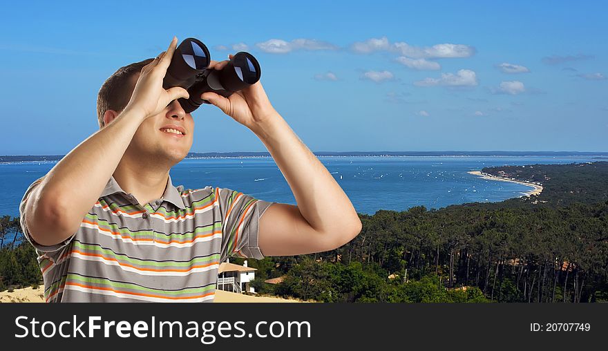 Tourist looking trough field-glasses