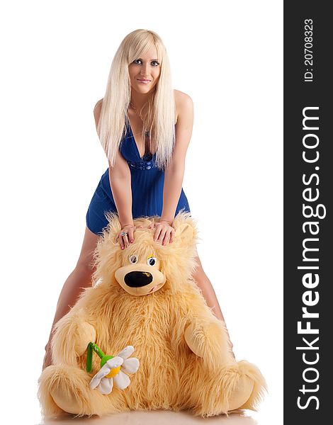 Beautiful model with a bear in hands