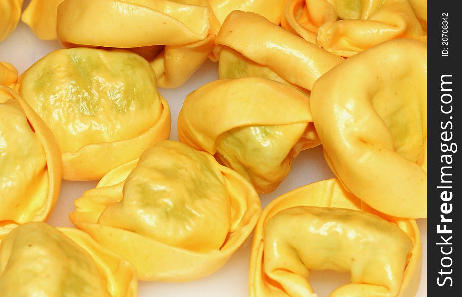 Tortellini - italian pasta with meat or cheese and other ingredients inside