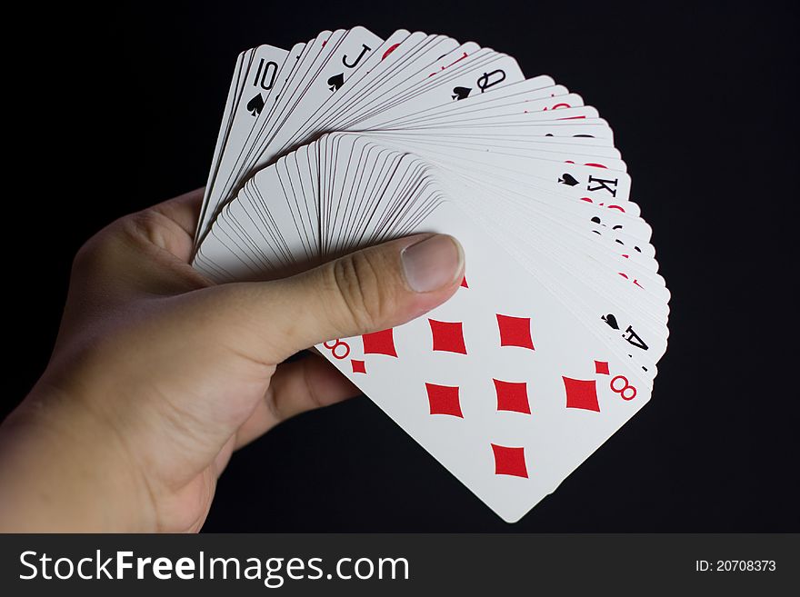 A full deck of cards with a hidden royal flush. A full deck of cards with a hidden royal flush