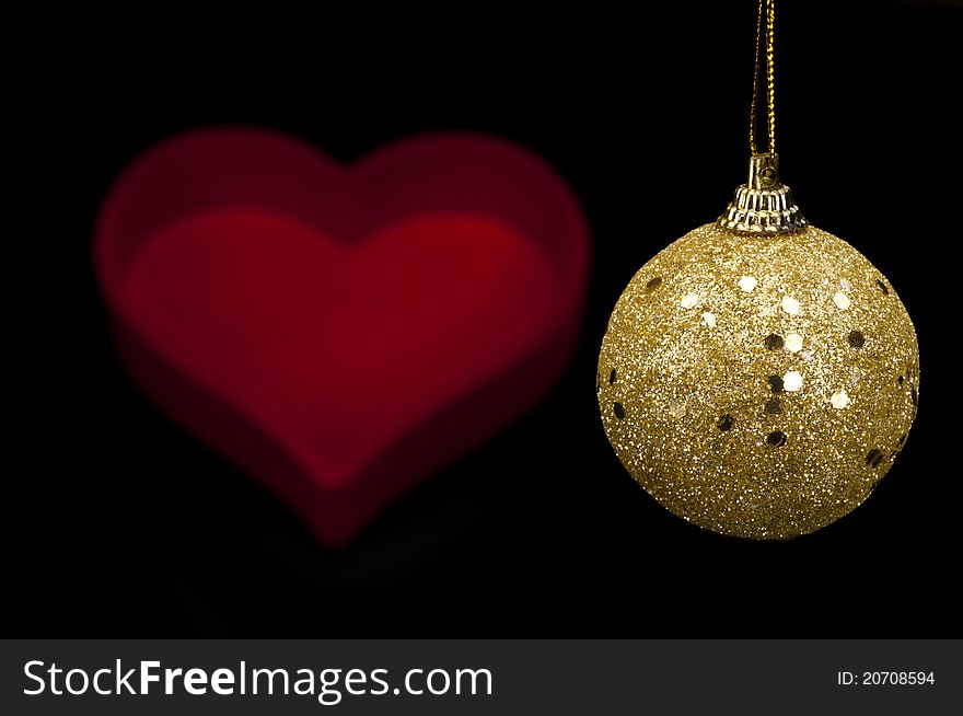 Christmas Ball with heart on black background