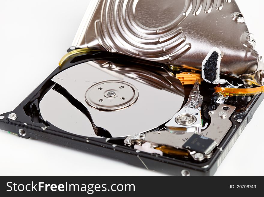 Broken hard disk drive on gray background. Broken hard disk drive on gray background