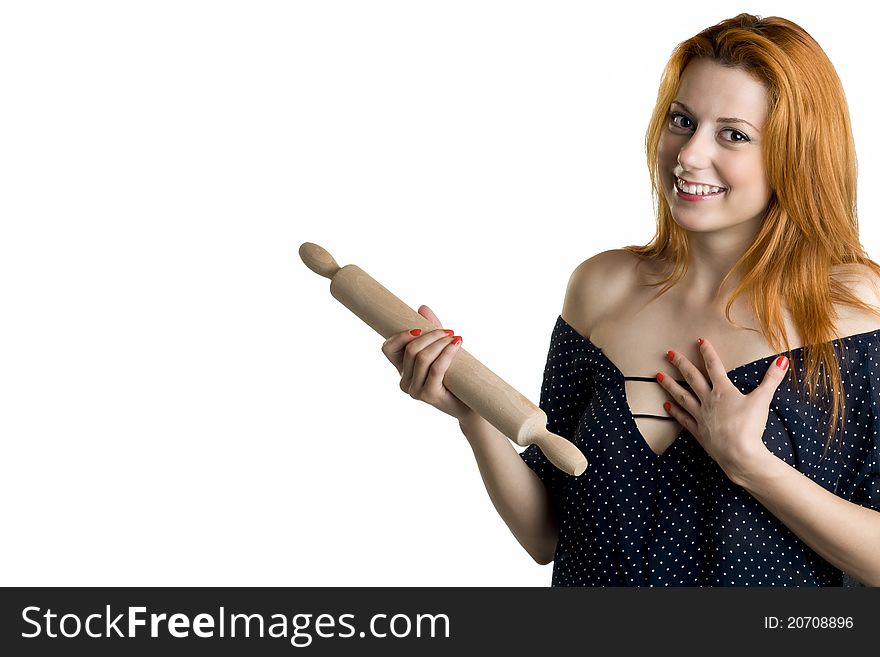 Young woman with a wooden rolling pin