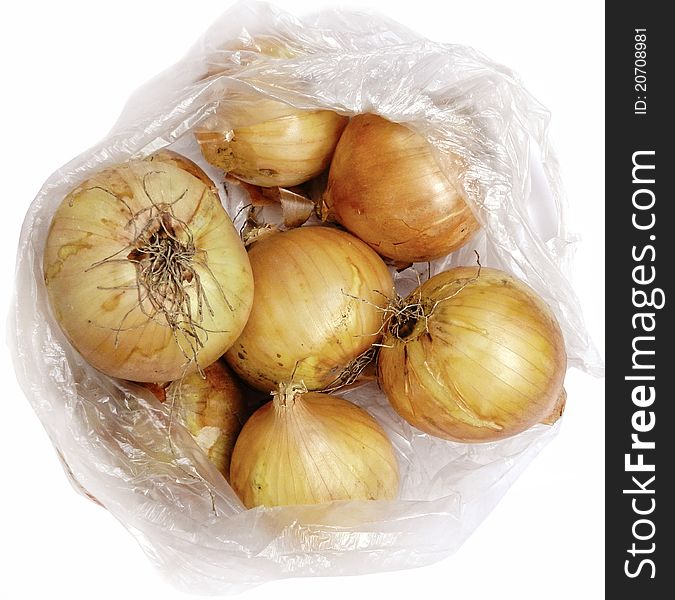 Onion in cellophane on a white background