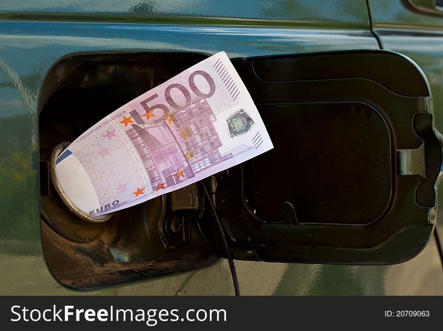 Banknote of 500 euro is in petrol tank. Banknote of 500 euro is in petrol tank