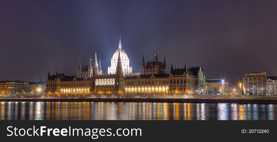 Night shot of the Hungarian Parliament building with the river Danube in the foreground, Budapest, Hungary.