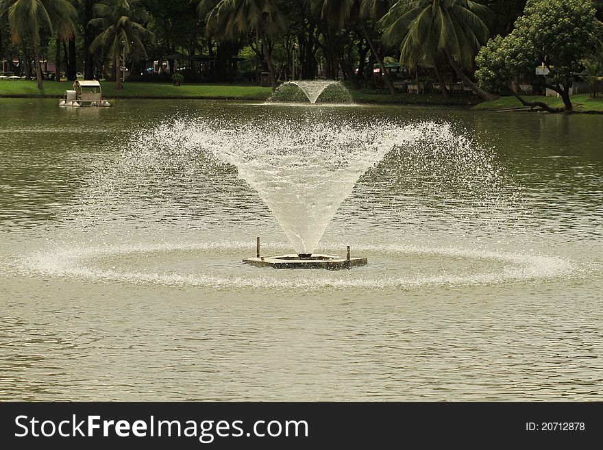 Fountain with round water drop in lake. Fountain with round water drop in lake