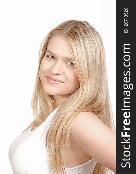 Pretty young woman posing. She has blond hair white tank top and very nice smile. Pretty young woman posing. She has blond hair white tank top and very nice smile.