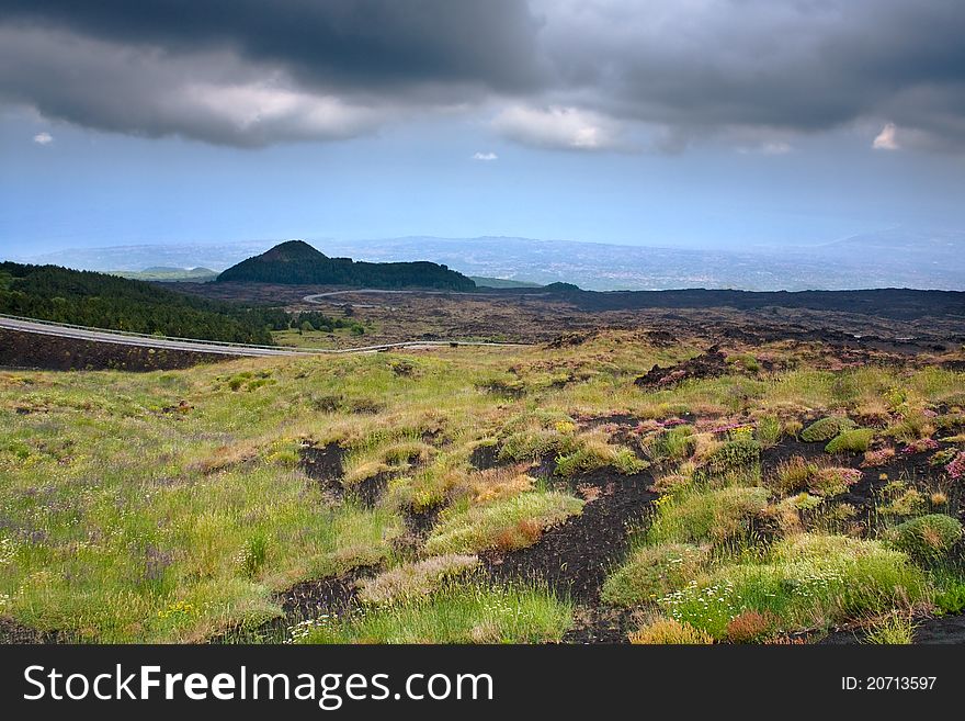 Mountain road in clinker ground on volcano Etna, Sicily. Mountain road in clinker ground on volcano Etna, Sicily