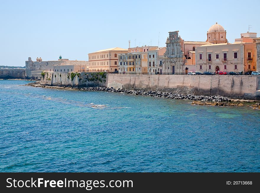 View on Castello Maniace and embankment in Syracuse, Sicily in summer day