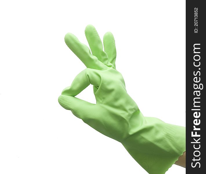 Hand of housewife in a green kitchen glove gesturing OK isolated on white background. Hand of housewife in a green kitchen glove gesturing OK isolated on white background