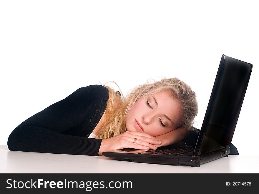 Cute blonde with a laptop at the table. Cute blonde with a laptop at the table