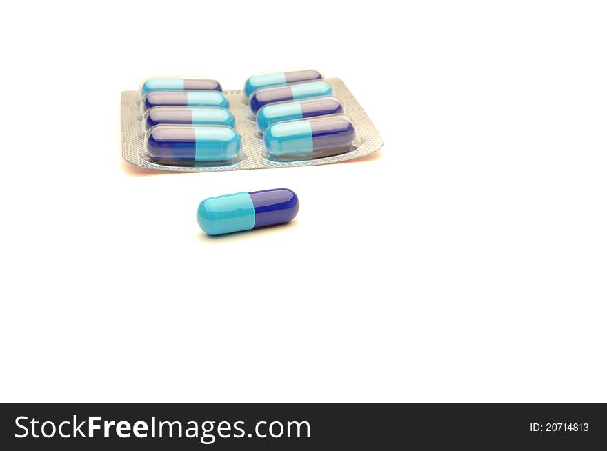 vitamin pills on a white background