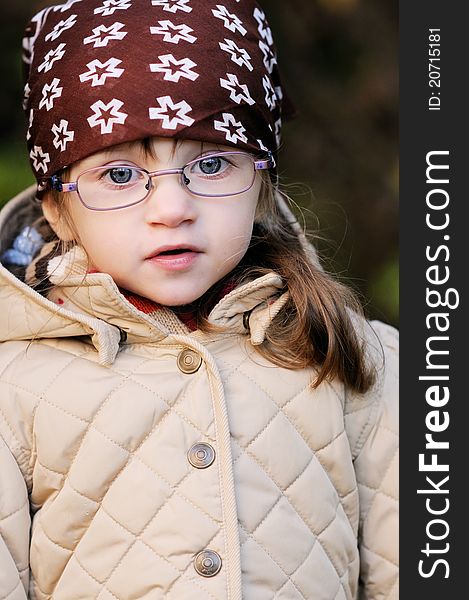 Portrait of adorable toddler girl wearing kerchief