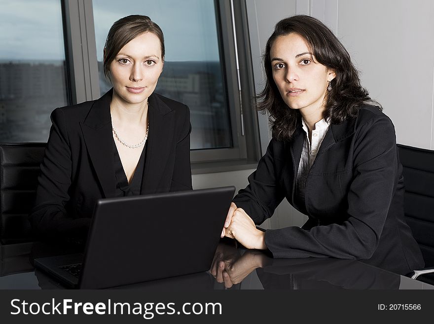 Latin businesswoman in office with collegue