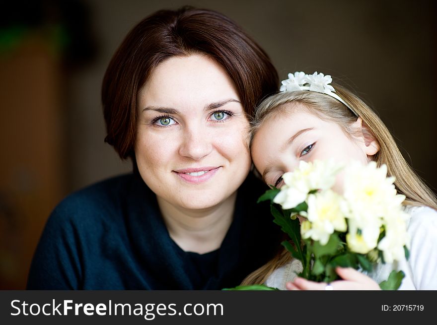 Portrait Of Lovely Mother And Child With Flowers