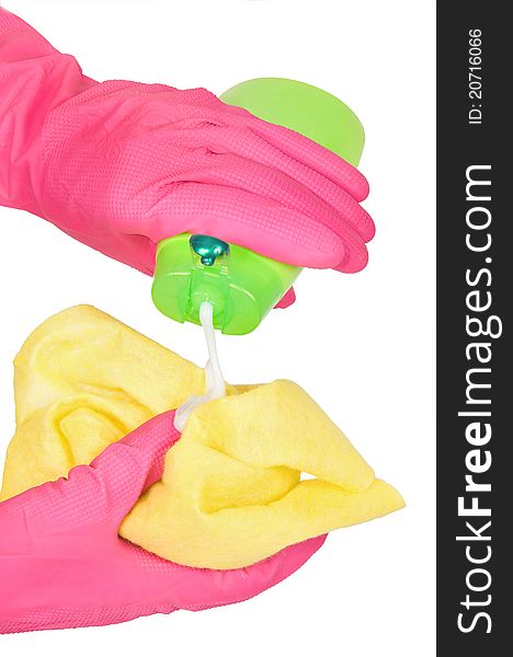 Hands in rubber gloves with a rag and bottle green. Hands in rubber gloves with a rag and bottle green