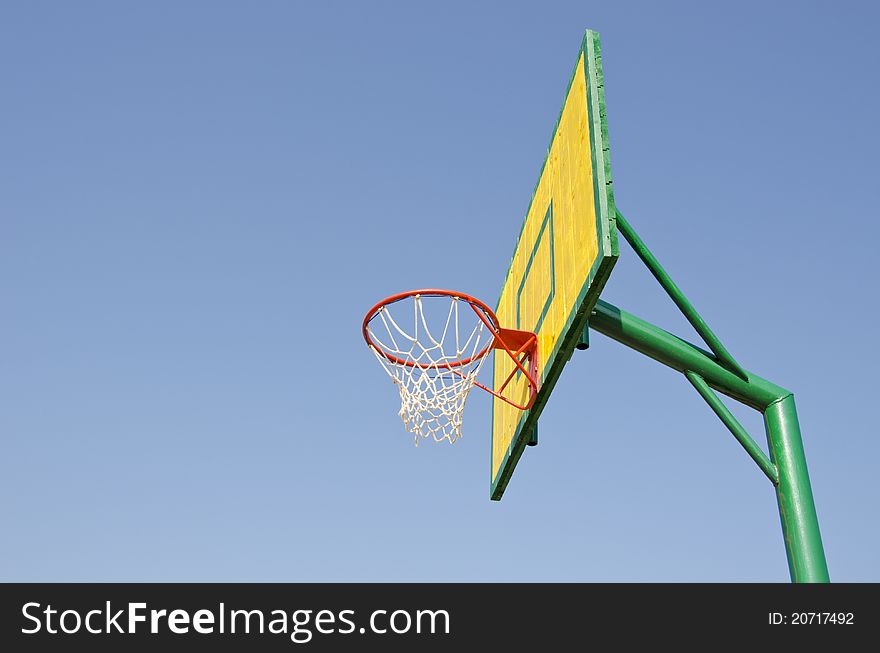 Yellow, red and green backboard on sky background