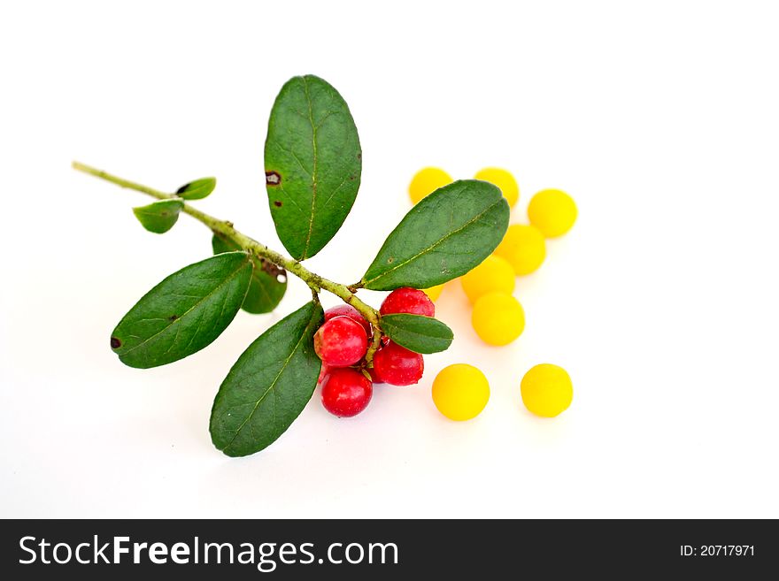 Natural and Artificial vitamins on a white background