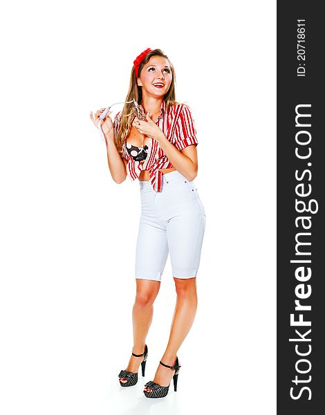 Young, happy girl sprinkles over the perfume, isolated on a white background. Young, happy girl sprinkles over the perfume, isolated on a white background.