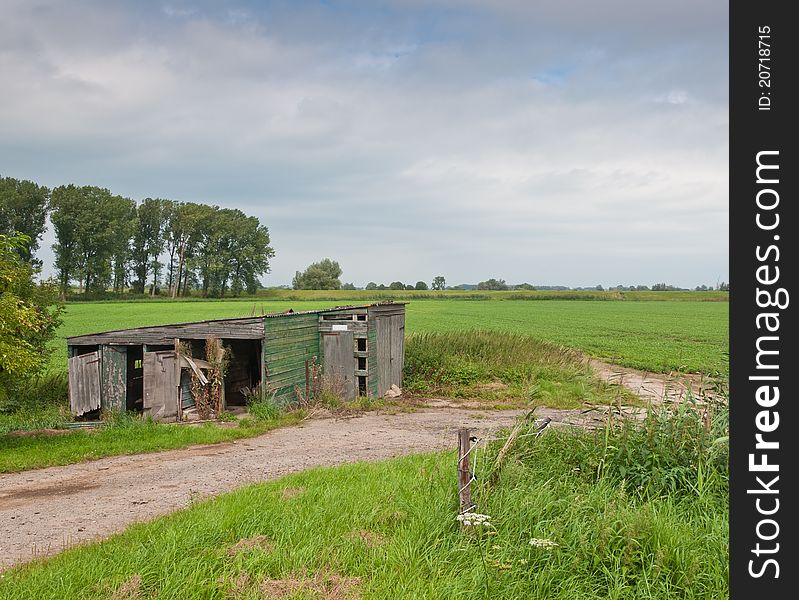 Dilapidated barn in a Dutch landscape. Dilapidated barn in a Dutch landscape