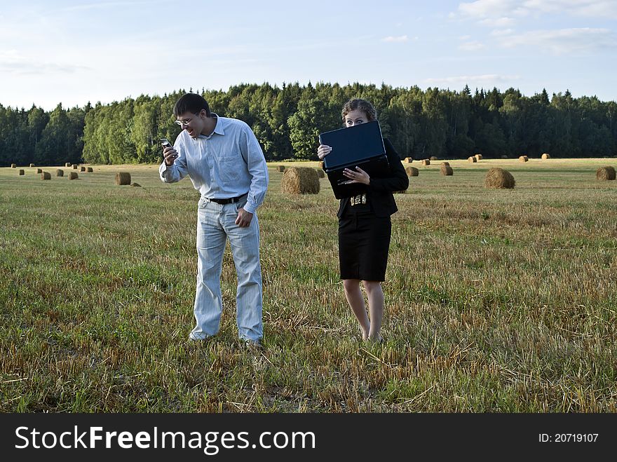 Teamwork at the field. two person and laptop. Teamwork at the field. two person and laptop