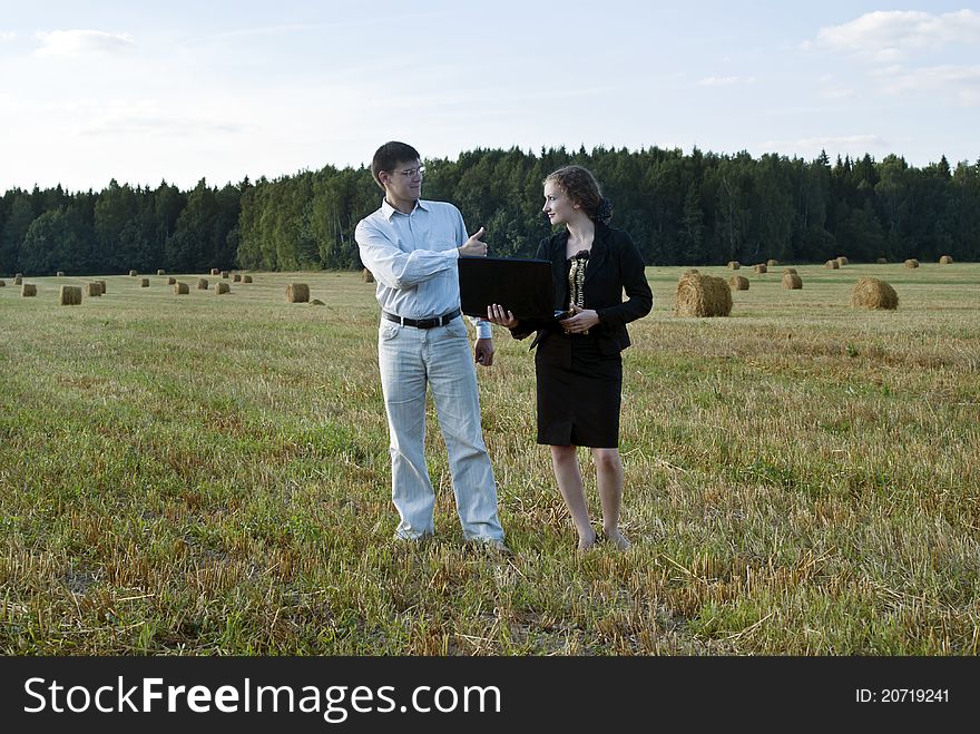 Teamwork at the nature. two person and laptop. Teamwork at the nature. two person and laptop