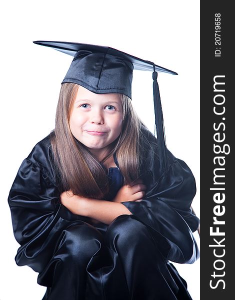 Portrait of cute girl with long blond hair in black academic cap and gown on isolated white. Portrait of cute girl with long blond hair in black academic cap and gown on isolated white