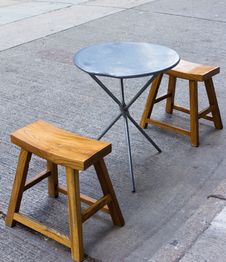Table And Chairs On Street Stock Photos