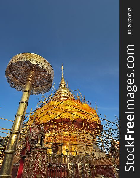 Golden stupa and umbrella structure