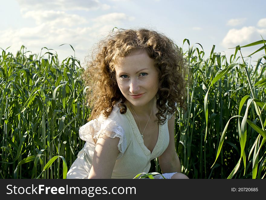 Smiley curly girl on nature