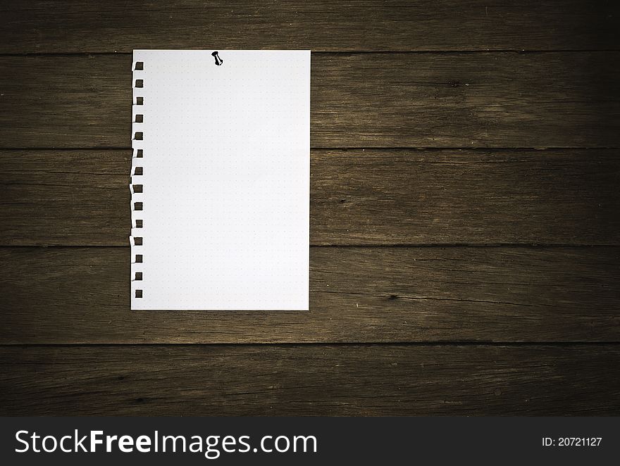 Blank paper on wood background