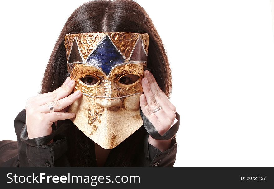 Photo studio with a model with Venetian mask covering his face and white studio background