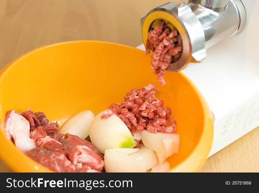 Meat through a meat grinder for force meat