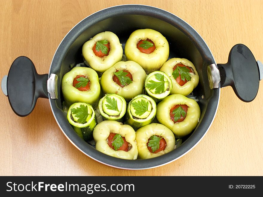 Pan with stuffed meat peppers and zucchini