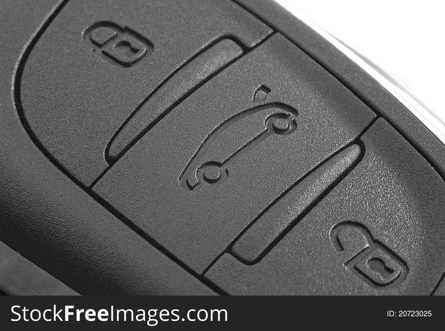 Macro photograph of a remote control buttons on a car key. Macro photograph of a remote control buttons on a car key
