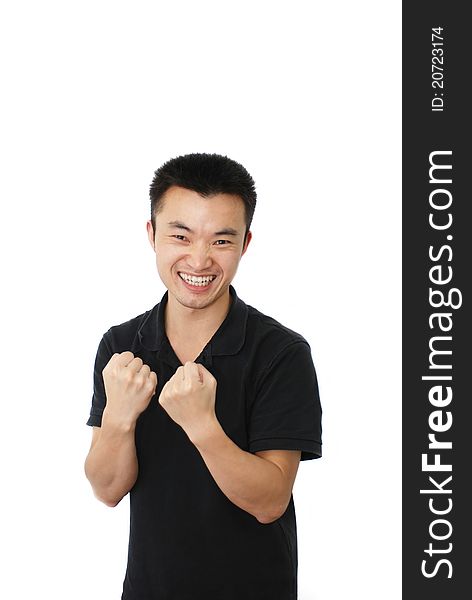 Young man with 'yeah' gesture isolated over white background