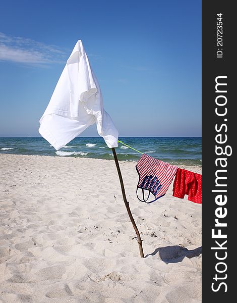 Shirts drying on the beach