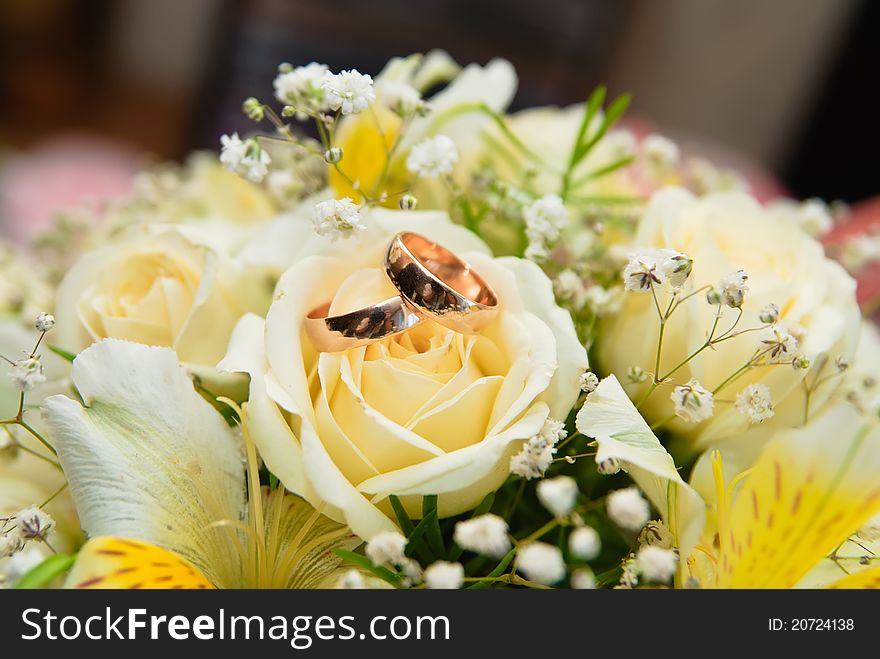 Wedding rings on a bridal bouquet. Wedding rings on a bridal bouquet