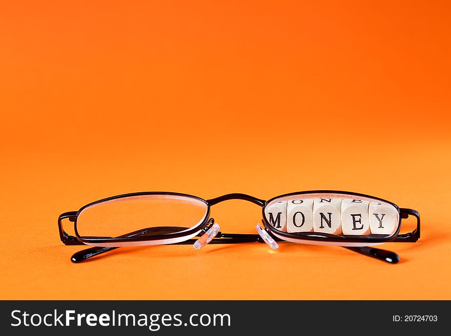 Glasses with letters and word money concept. Glasses with letters and word money concept