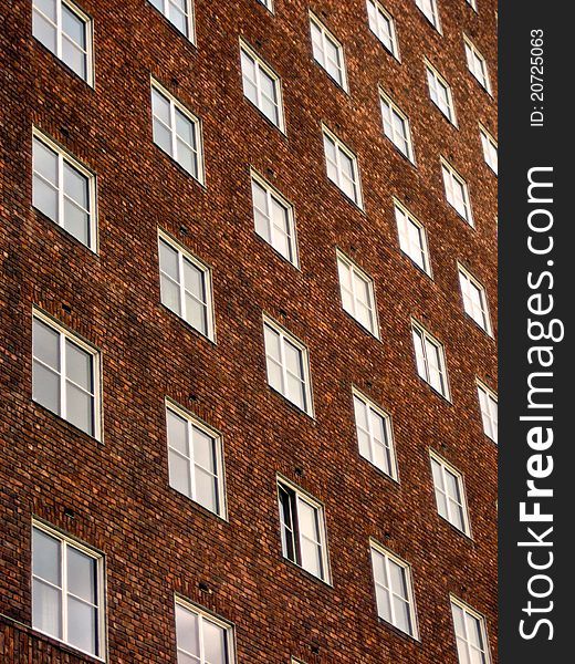 Geometric pattern of brown brick and simple windows. Geometric pattern of brown brick and simple windows