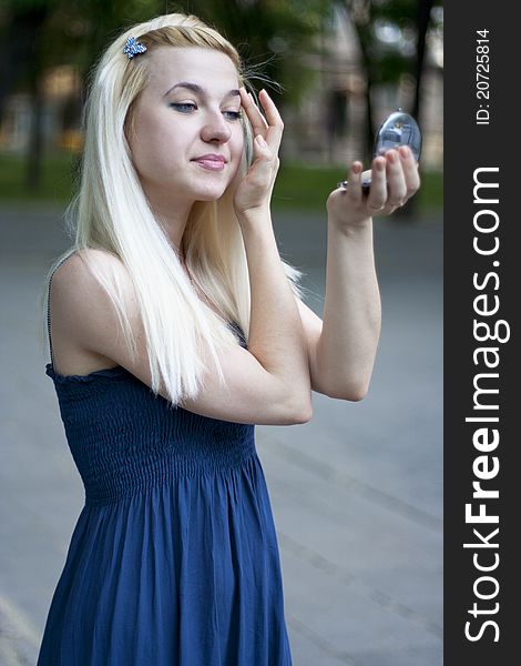 Portrait of young woman in small mirror. Portrait of young woman in small mirror