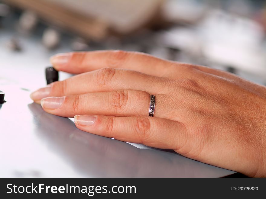 Woman's hands on the remote control in an industrial plant