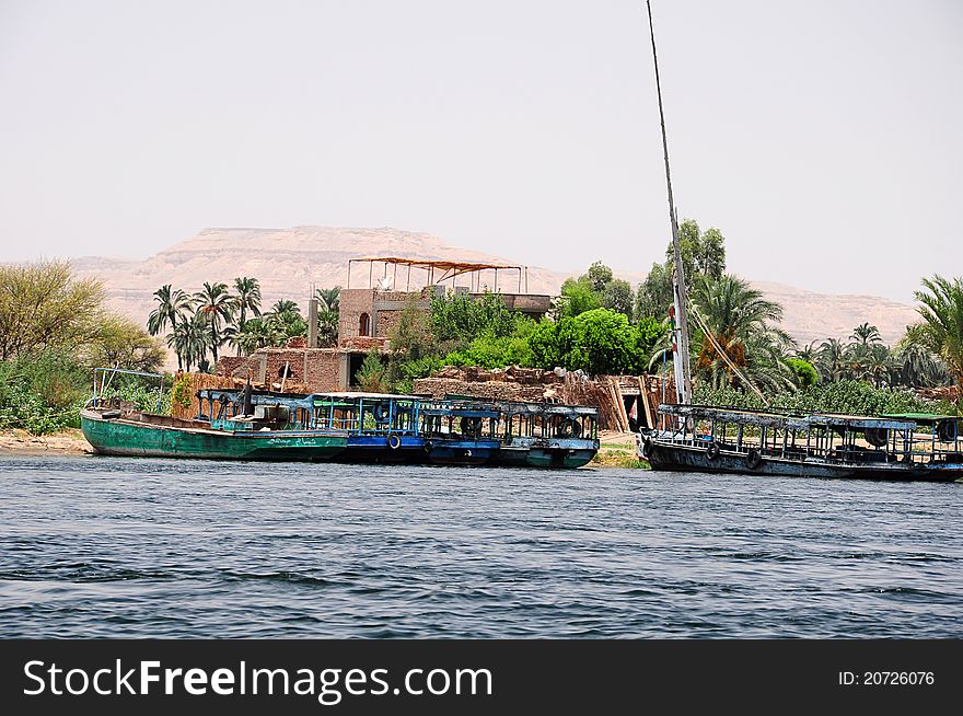 Old boat floating down the Nile in Egypt. Old boat floating down the Nile in Egypt