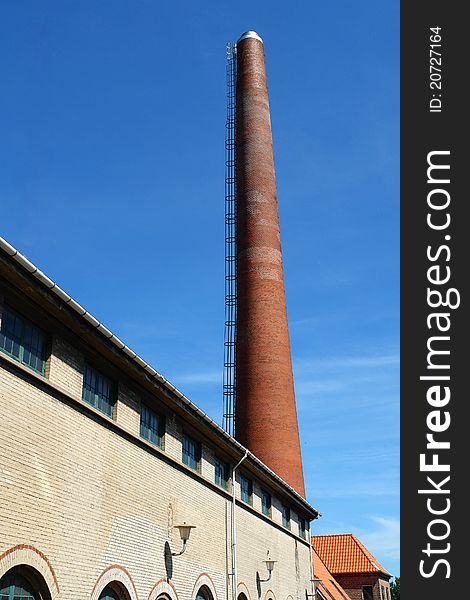 Factory plant building with a chimney vertical industry manufacturing background