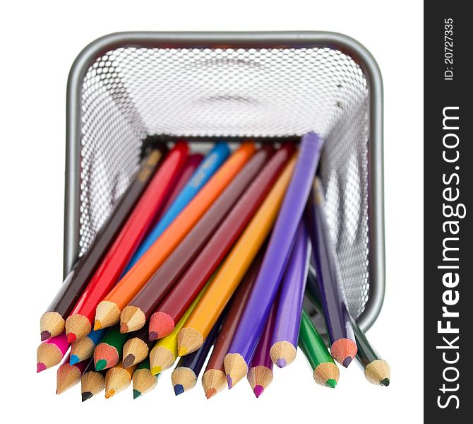 Color pencils in pencil holders on white background