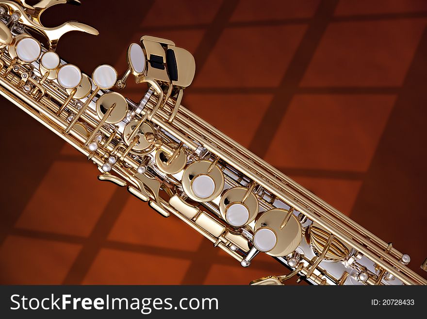 Soprano Saxophone Isolated Against Gold