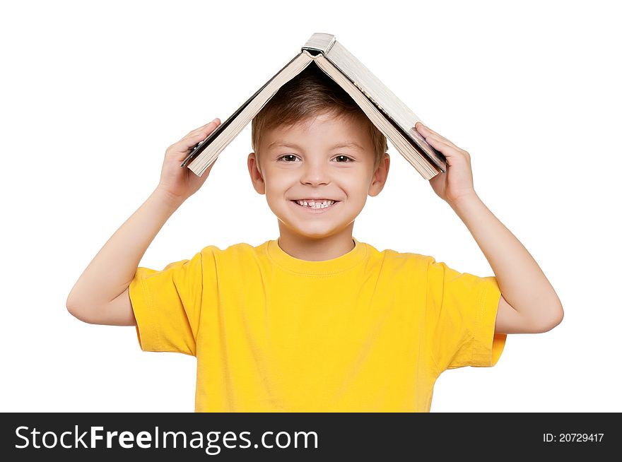 Portrait of little schoolboy with book on white background. Portrait of little schoolboy with book on white background