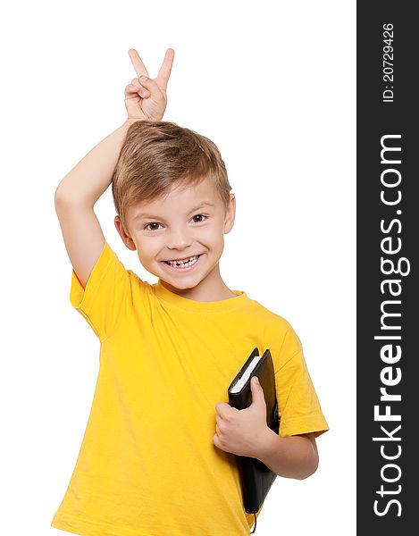 Portrait of little schoolboy holding book on white background. Portrait of little schoolboy holding book on white background