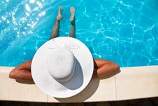 Young Woman Sitting Near Pool. Royalty Free Stock Images